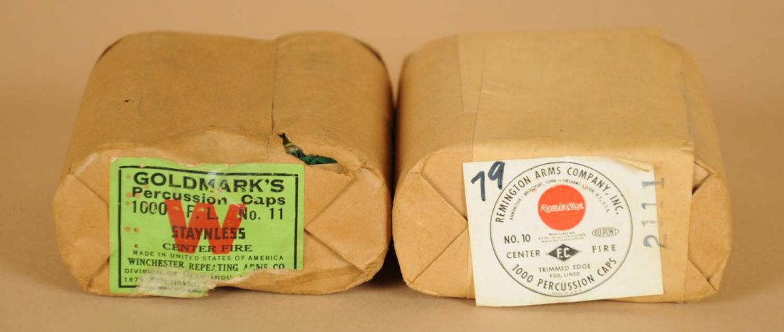 Two Sealed Packages of Percussion Cap Tins.: This lot consists of two full packages of Winchester and Remington. Each contains ten tins of percussion caps. Each is still sealed with label on end. Condition (Very Good).