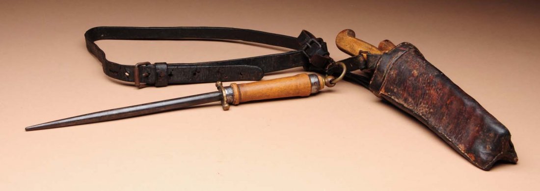 Hide Butchering Kit.: Late 19th century, early 20th century. Includes three knives and sharpening steel, all attached to a wonderful early belt in a great old leather and wooden case. Hand-sewn leather and handmade. Condit