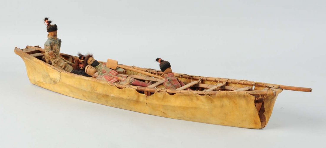 Late 19th Century Inuit (Eskimo) Umiak.: Seal hide covered boat. Includes five figures with cotton and wool costumes, and human hair. The figures have jointed knees and articulated arms. Wonderful detailed carved wood dolls with leather and 