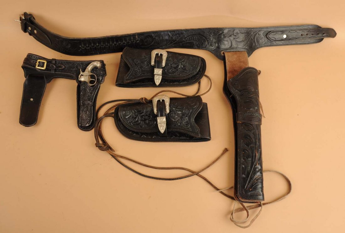 Lot of 3: Pistol Rigs and Two Holsters.: Includes one made by La Casa de Don Jorge of Los Angeles. Marked "Custom Made Expressly for Robert C. Martin" with a silver and 10k gold buckle with his initials. Also includes miniature salesman's sa