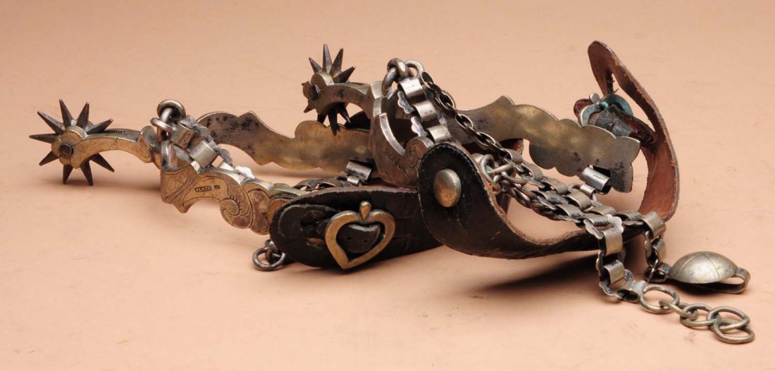 Pair of Spurs Marked Artigas.: This pair of spurs is marked Artigas and E. Sturba. Moderate wear to the leather areas. Condition (Very Good Plus). Size 6 - 1/2" L.