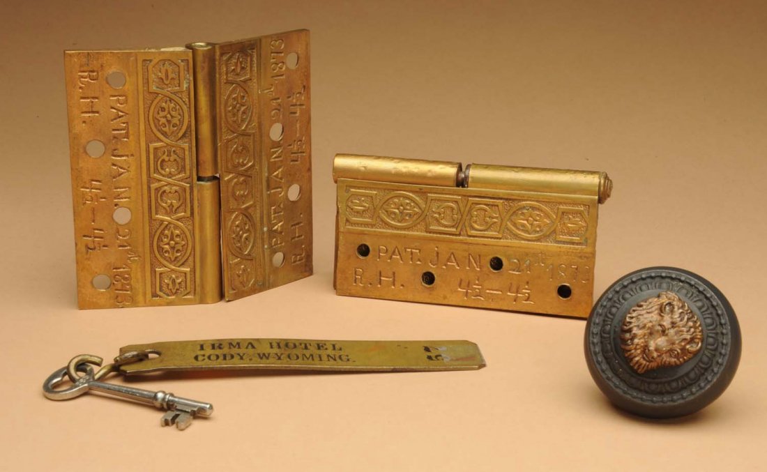 Lot of 4: Items from Buffalo Bills Hotel.: Hinges from Irma Hotel in Cody, WY., built in 1906 and owned by Buffalo Bill. Hinges are dated 1873. Original buffalo head doorknob from the same hotel. Lot also includes a key. Condition (Excellent).