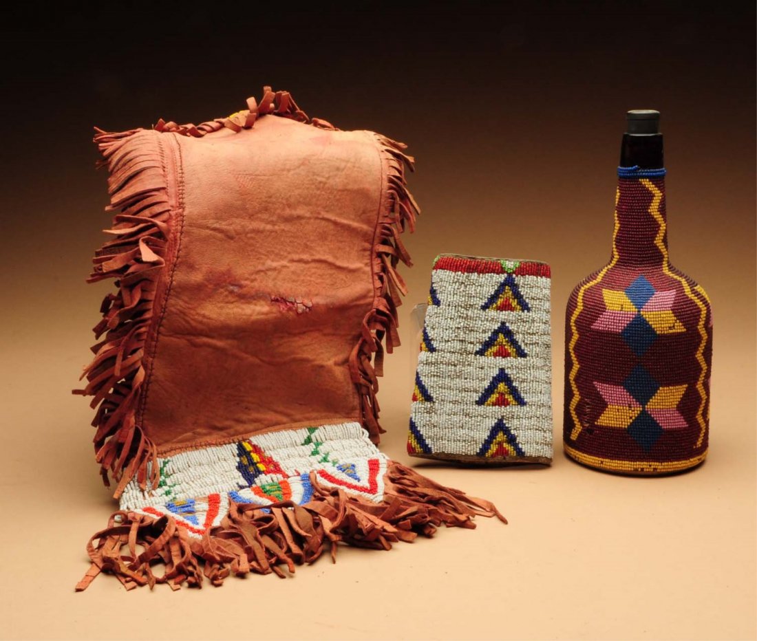 Lot of 3: Beaded Pieces.: One early beaded bottle from the 19th century. Thread sewn, from northern California. One signle 1880s-1910 Sioux dance cuff on Indian made rawhide, and one 20th century commercial leather and thread 