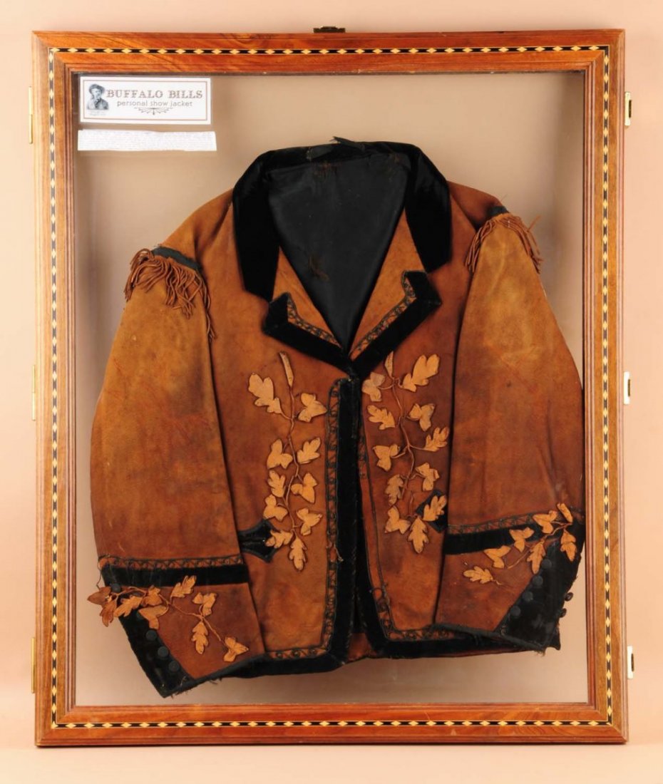 Buffalo Bill's Personal Show Jacket.: Attributed to Buffalo Bill. Leather jacket in deep rust brown with black velvet trim around edges, cuffs, shoulders, and collar facings. Light leather cut-outs appliqued to face and cuff area done in 