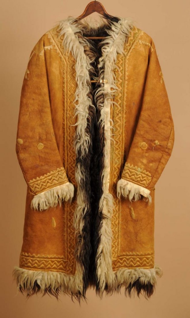 Wild West Show Era Decorated Western Overcoat.: Button lined. Embossed accents, fur collar. Hand sewn repairs on the shoulder and minor leather repairs. Condition (Very Good).