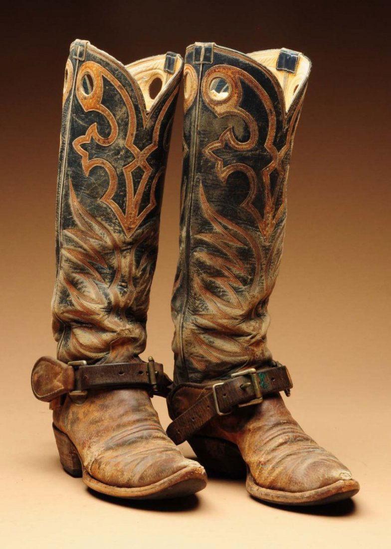 Pair of Much Used Cowboy High Top Boots.: Circa 1930s-40s. With pair of unsigned overlaid nickel on iron spurs. Working bronc buster buckled straps. Condition (Fair). Size Each: 17 - 1/2" T.