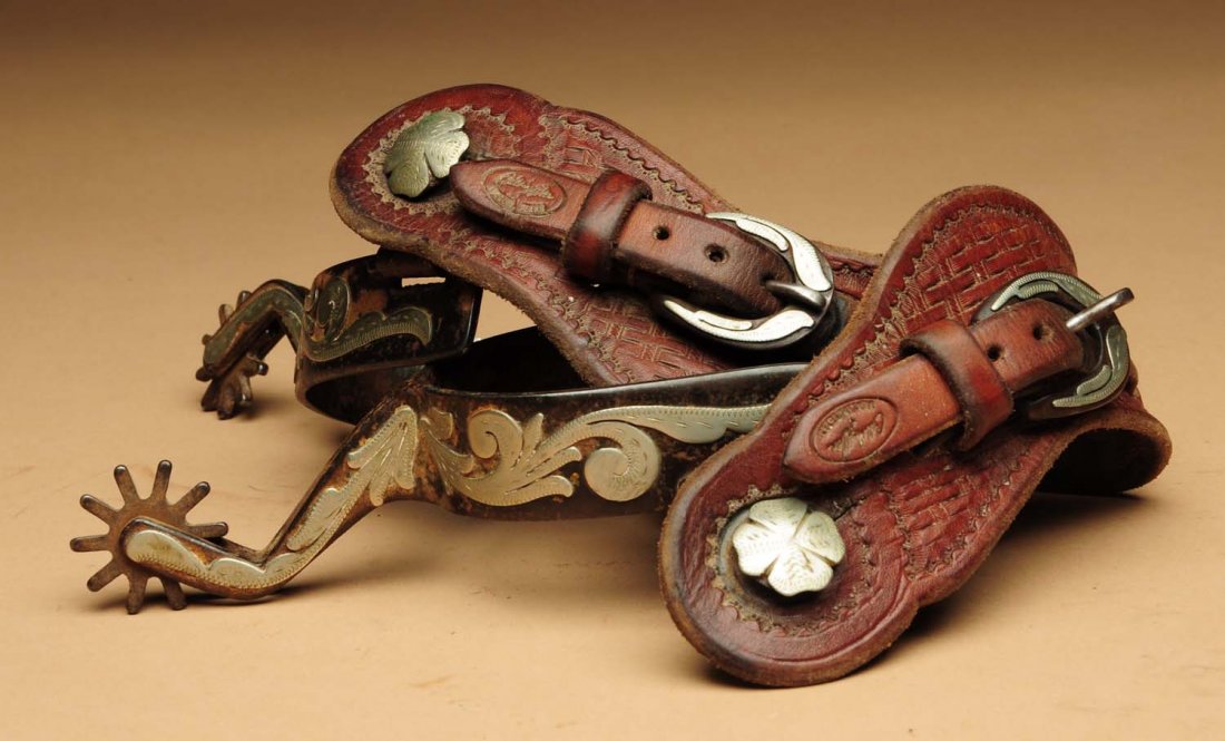 Pair of Signed Overlaid Cowboy Spurs.: Signed "Andrews 1990". With marks, 20th century Texas made straps and fine overlaid buckles. Shows wear and use. Condition (Good). Size Each: 8" L.