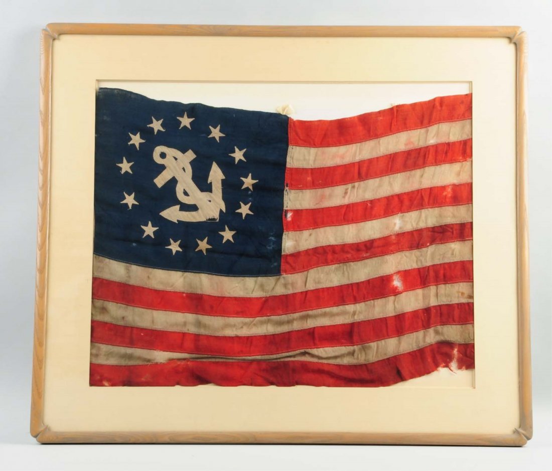 13-Star US Yacht Club Ensign Flag.: These flags have been used since 1848 to identify American Pleasure Craft in US waters. Flag is all original featuring a Navy anchor surrounded by 13 stars. It is poorly mounted in a frame. Flag shows