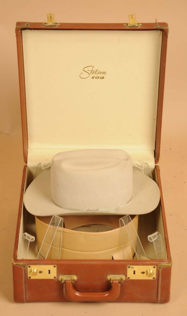 Stetson Hat with Travel Case.: This Stetson hat includes a Stetson travel case. The hat has a number of pinholes but the travel case is in great condition. Condition (Very Good Plus). Size 15" L.