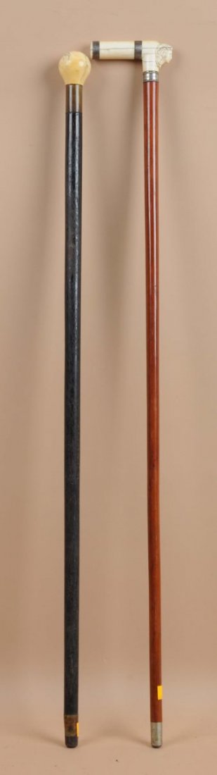 Lot of 2: Ivory Top Canes.: One with a silver band with an inscription "To John J Williams from J.L". Condition (Very Good). Size Largest: 35-1/2" L.
