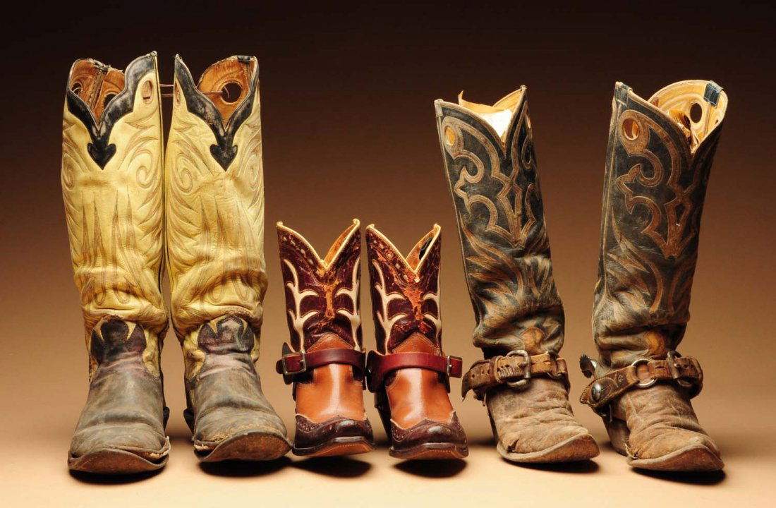 Lot of 3: Pairs of Well Used Vintage Cowboy Boots: One with working spurs, and a sub-adult pair with nice contemporary store-bought spurs. All three pairs show full use. Condition (Fair). Size Largest: 17" L.