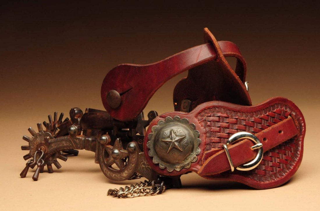 Pair of California Spurs.: Signed "E. Garcia" with engraved silver inlays and a crescent and star motif. Unmarked leather straps. Condition (Very Good). Size Each: 13" L.