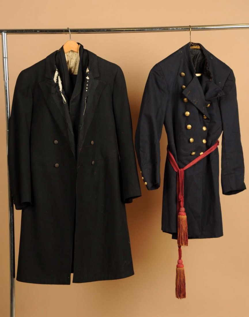 Lot of 2: Early Garments.: This lot includes a long black coat and a waist-length navy blue military jacket. The black coat has heavy wear and the blue jacket has minor overall wear. Condition (Good - Very Good).