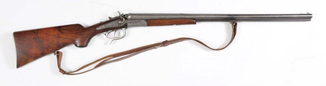 Schafer Hammer Drilling Cape Gun**: Serial No. 52. Pre-World War II. Barrel length: 27-1/2". Chamber length: 2-1/2". Choke dimension: R - cylinder; L - Full. Length of pull: 13-1/2". Drop on the heel: 2-3/4". .22 Hornet 16 gauge. The ba