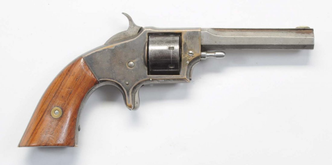 Rollin White Arms Revolver Presentation W.F. Cody: Serial No. 6773. Made for Smith & Wesson. It is a .22 short rimfire, seven shot non-fluted cylinder, 3-3/16" octagon barrel. The cylinder retains 75% of the brilliant blue finish, the barrel is in the