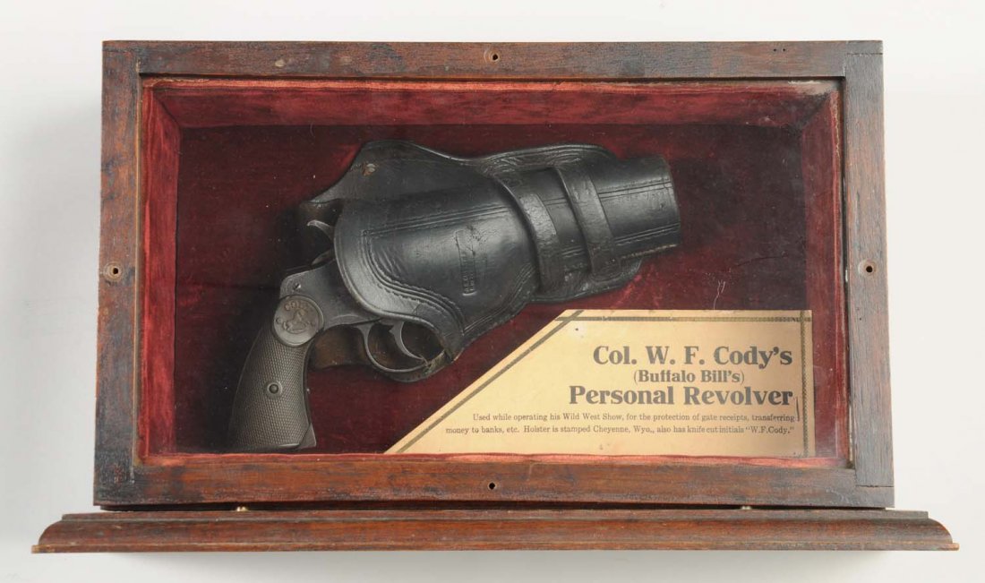 Col. W.F. Cody's Personal Colt Revolver.**: This is an interesting colt revolver with history. It is housed in a custom vintage oak case with red velvet lining. A rare and valuable J.S. Colins & Co. Cheyenne WY. Double loop holster intact in th