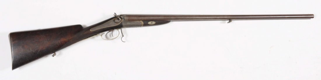 G.L. Rasch Hammer SxS Shotgun.: Serial No. 294. Manufactured 1860 - 1870. Barrel length: 31-1/8". Chamber length: 2-1/2". Choke dimension: R - cylinder; L - cylinder. Length of pull: 13-7/8". Drop on heel: 2-1/2". Barrel has some de