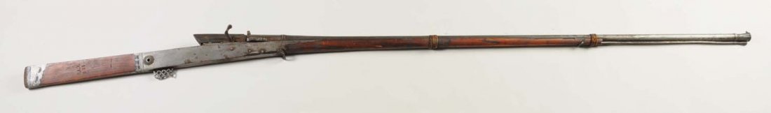 Early Middle Eastern Rifle.: This rifle is in relic condition. Clean metal, broken forestock, leather bands. Measures 68" long. Sold as decoration only.