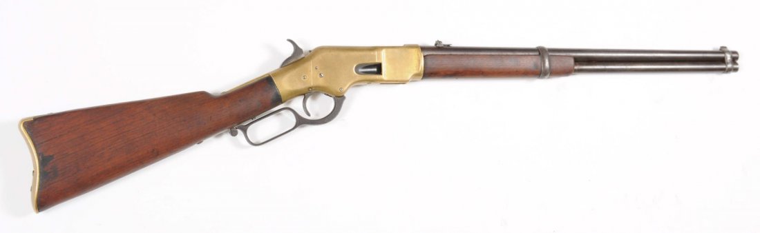 Winchester Model 1866 Sadde Ring Carbine.: Serial no. 135210. This carbine manufactured in 1877, is standard with 20" round barrel, full magazine, and carbine butt plate. The metal surfaces are a smooth dark patina. Barrel stamps are readable.