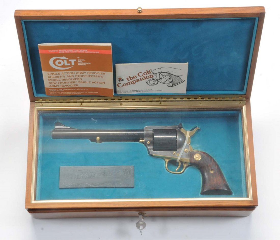 Colt Abercrombie & Fitch New Frontier .45 Comm.**: Serial No. 339. New in glass top display case is the standard Colt .45 New Frontier target, specially made for Abercrombie & Fitch in a limited number. It is in unfired condition. Slight drag line. Fe