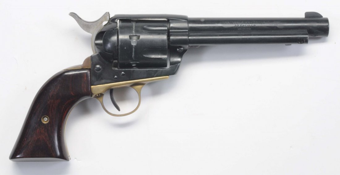 Hawes Western Six Shooter .22 Revolver.**: Serial 82437. Hawes copy of the Colt SAA in 22 rimfire. Features a 5 ½” barrel, full blued finish and wood grips. Action is perfect. Sharp bore. Most of the original finish present with dime size b