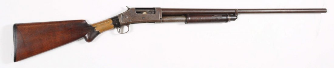 Winchester 1897 12 Ga. Pump Action Shotgun.**: Serial No. 348262. Manufactured 1906. Barrel length: 30". Chamber length: 2-9/16". Choke dimension: full. Length of pull: 13-7/8". Drop on heel: 2-1/2". Damascus barrels and frame are patina; bore is 