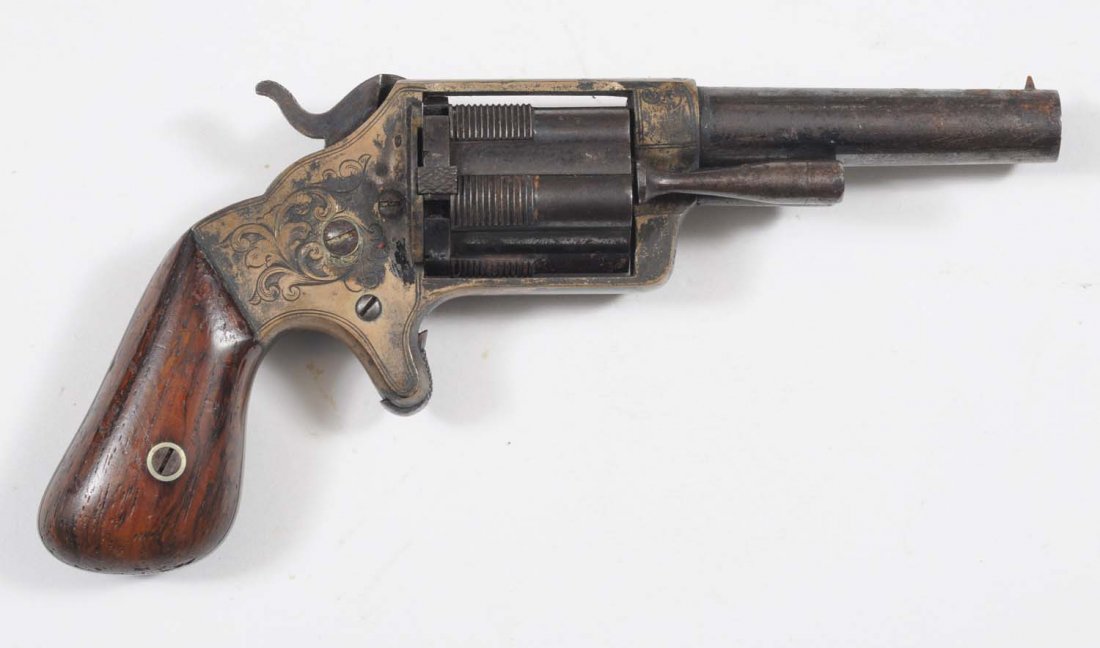 B.A. Co. Spur Trigger Pocket Revolver.: Five shot fluted cylinder .32 rimfire. Engraved brass frame. Blued barrel and cylinder has turned brown patina. Frame is dark with remnants of silver plating. Excellent grips. Not working.
