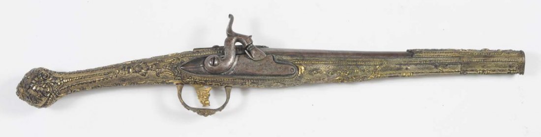 Ornate European Metal Stock S.S. Pair of Pistols.: Overall length is 19", .56 caliber percussion. Smooth bore. Stocks cast in metal with full relief. Barrel is brown. Bore is excellent. Working. No maker marks, but some foreign proofs. Sold with match