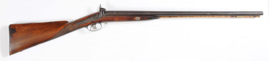 Adam's Express Percussion 12 Ga. SxS Shotgun.: No serial number. Circa approximately 1850 - 1860. Barrel length: 30". Choke dimension: right - cylinder; left - cylinder. Length of pull: 14-5/8". English proofs. The gun has Adam's Express markings 