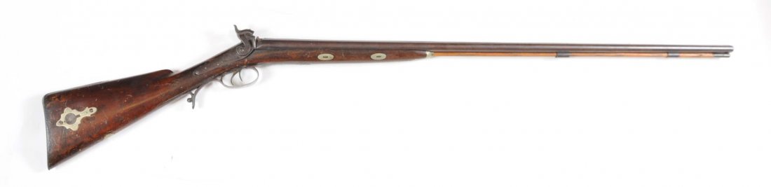 Manton Percussion 21 Ga. SxS Shotgun.: Manufactured 1830 - 1840. Barrel length: 42-1/4". Choke dimension: R - cylinder; L - cylinder. Length of pull: 14". A rib on the barrel is loose, the frame is patina, bore is dirty and pitted, and the
