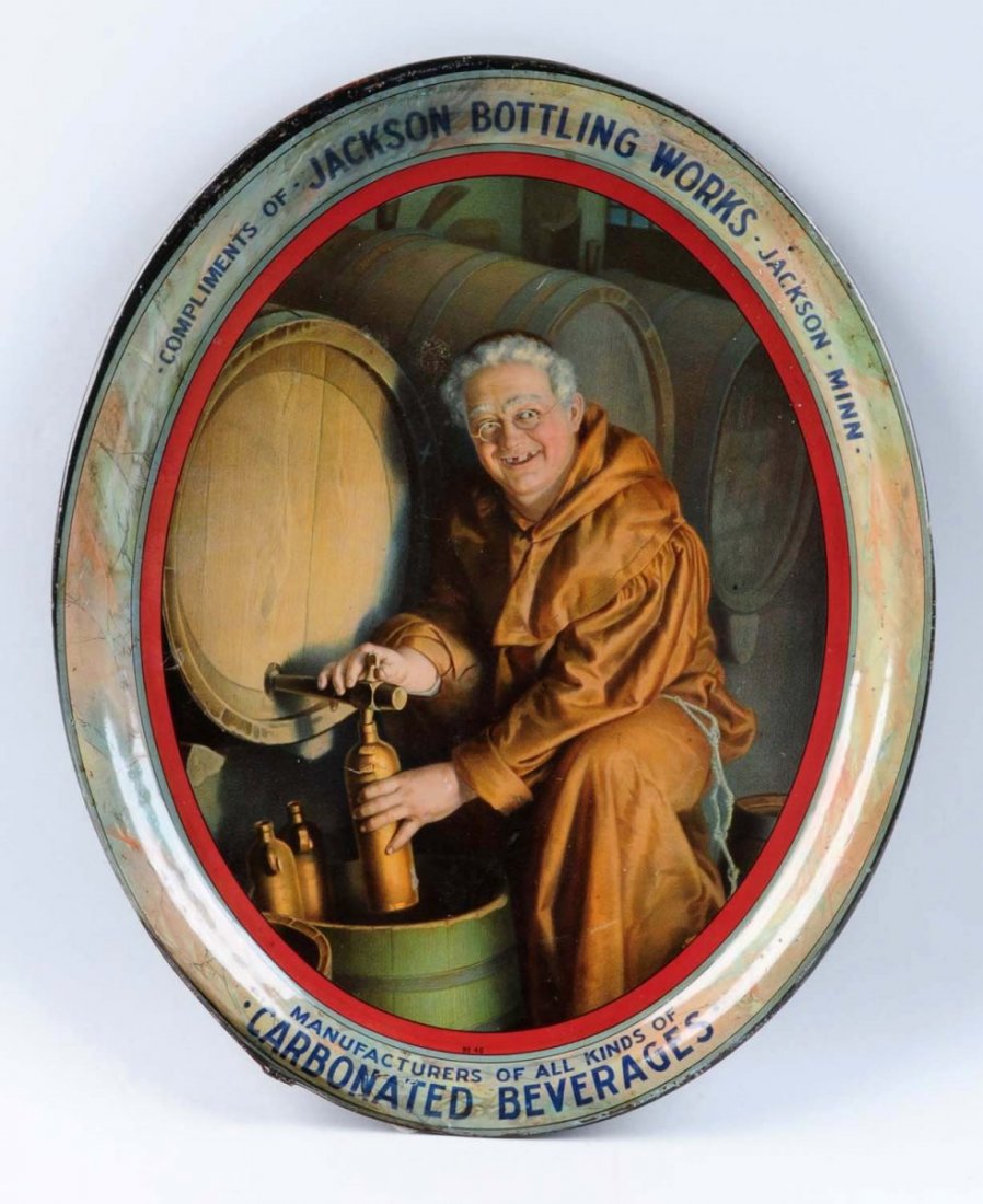 Jackson Bottling Works Serving Tray with Monk.: This tray has minor edge nicks and scrapes. The rolled edge seems to be unrolled at a point at the lower left. Condition (Very Good). Size 16 -1/2" L.