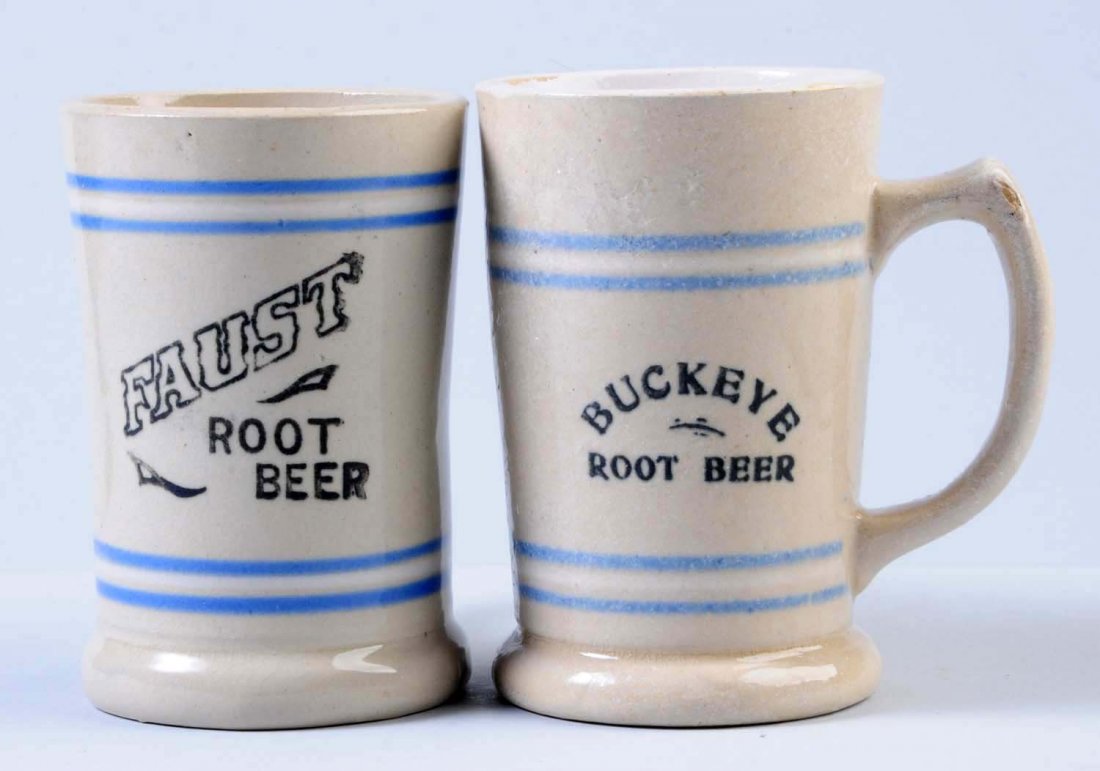 Lot of 2: Root Beer Mugs.: One mug is a Buckeye root beer mug. This mug has some sort of glaze put on top that has run down the inside of the mug. The other mug is a Faust root beer mug. Condition (Very Good Plus). Size Each: 5