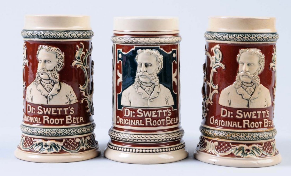 Lot of 3: Dr. Swett's Embossed Root Beer Mugs.: All three mugs are decorated in brown and green. Two of these are very nice and one appears to have some repair around the top lip. Condition (Very Good Plus). Size Each: 6" T.