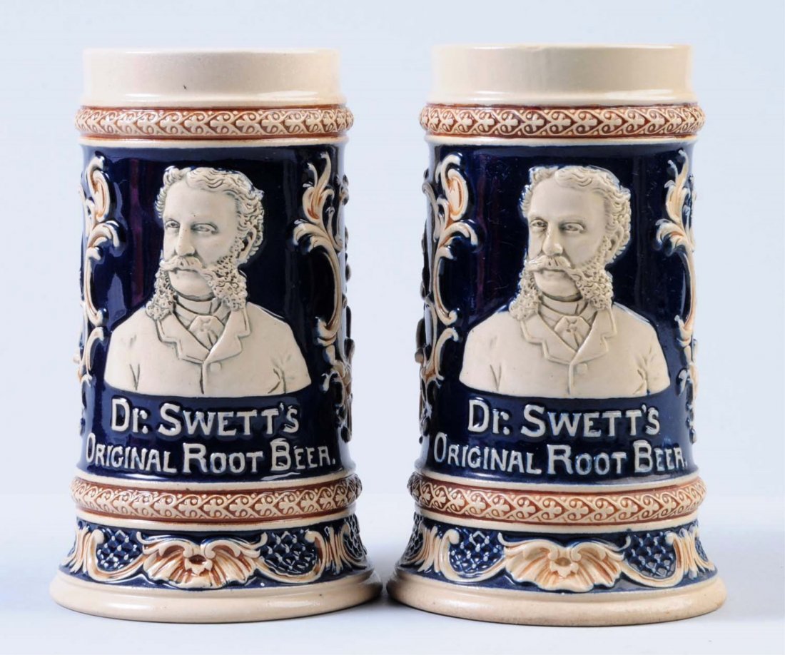 Lot of 2: Dr. Swett's Root Beer Mugs.: Both mugs are in very nice condition and are decorated in blue and brown. Condition (Excellent). Size Each: 6" T.