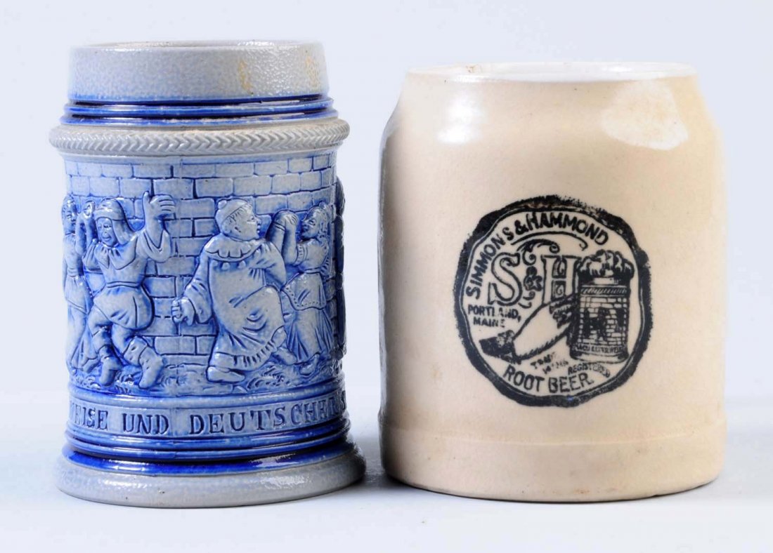Lot of 2: Stoneware Root Beer Mugs.: Both mugs were produced by the Simmons & Hammond Company. One is a blue decorated mug and the other is a typical stoneware mug. Condition (Excellent). Size Largest: 4 - 1/4" T.