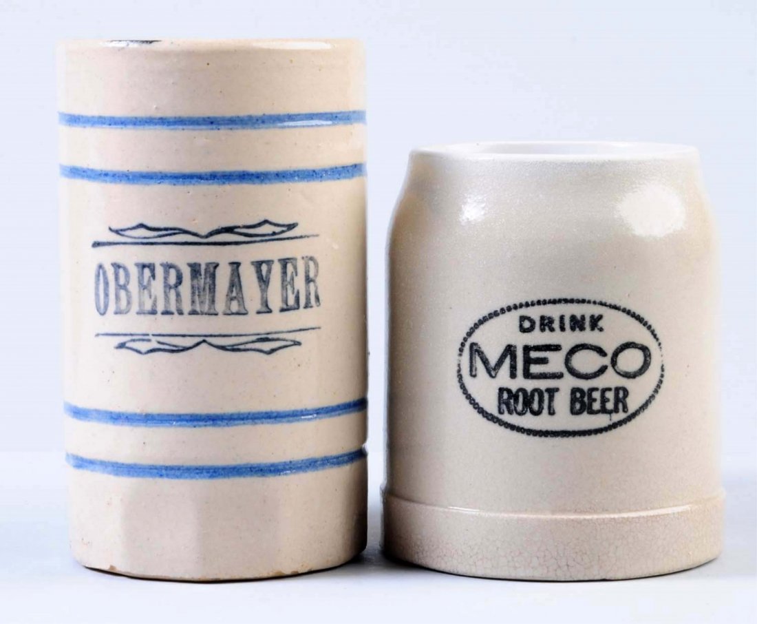 Lot of 2: Root Beer Mugs.: One is marked "Obermayer", and the other is a Meco root beer mug. Both mugs have some crazing. Condition (Very Good). Size Largest: 5" T.
