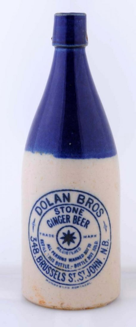 Dolan Bro's Stone Ginger Beer Stoneware Bottle.: This Large Bottle is decorated in blue and is from St. Johns. N.B. There are a few glaze pops near the top. Condition (Very Good) Size 10 - 1/2" T.