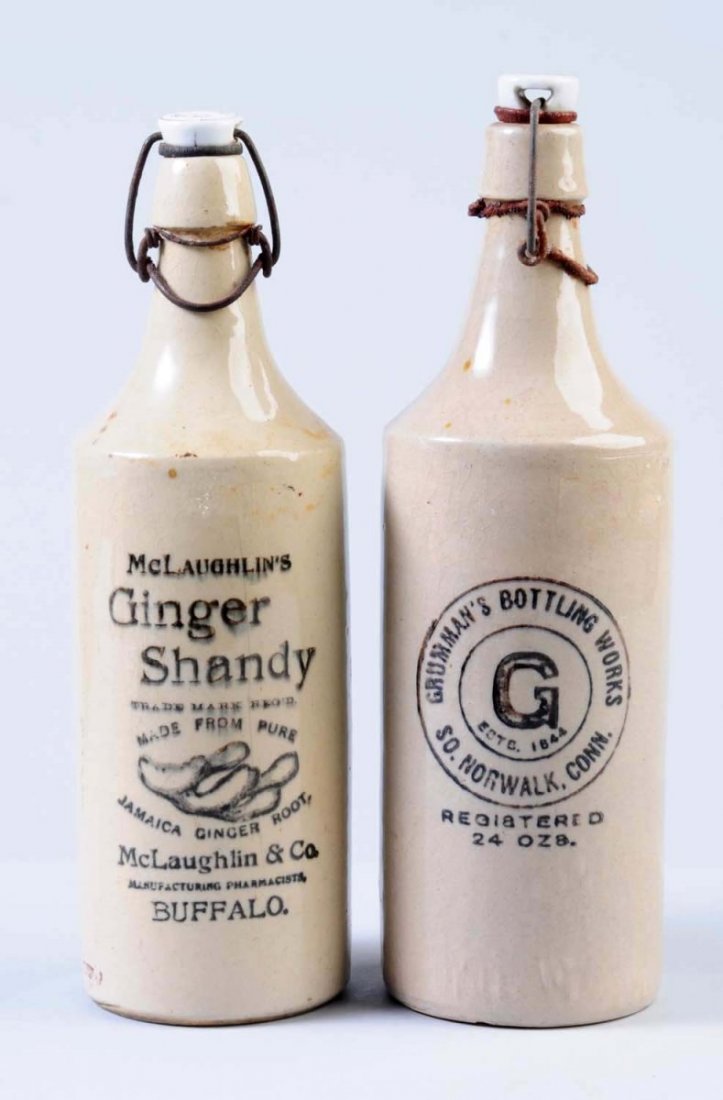Lot of 2: Larger Stoneware Beverage Bottles.: The first bottle is marked "Mclaughlin's Ginger Shanty Buffalo, NY." The second bottle is marked " Grumman's Bottling Works South Norwalk, Conn." Condition (Very Good Plus). Size Largest: 11" T.