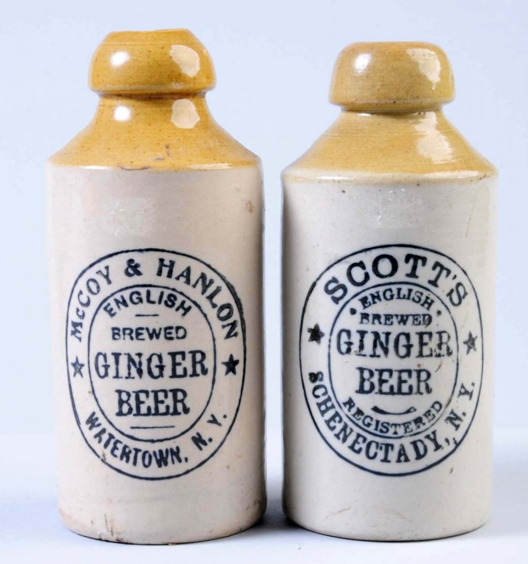 Lot of 2: Stoneware Ginger Beer Bottles.: The first bottle is marked "McCoy and Hanlon Watertown, NY." The second bottle is marked "Scott's English Brewed Ginger Beer Schenectady, NY." Condition (Very Good Plus). Size Largest: 7" T.