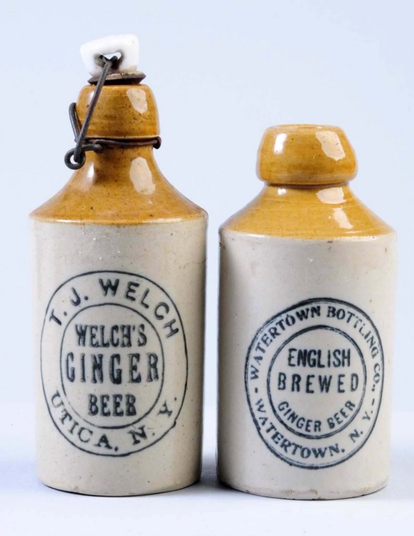 Lot of 2: Stoneware Ginger Beer Bottles.: The first bottle is marked "T. J. Welch Ginger Beer Utica, NY. " The second bottle is marked "English Brewed Ginger Beer Watertown Bottling Co. Watertown, NY. Condition (Excellent). Size Largest: 7 - 