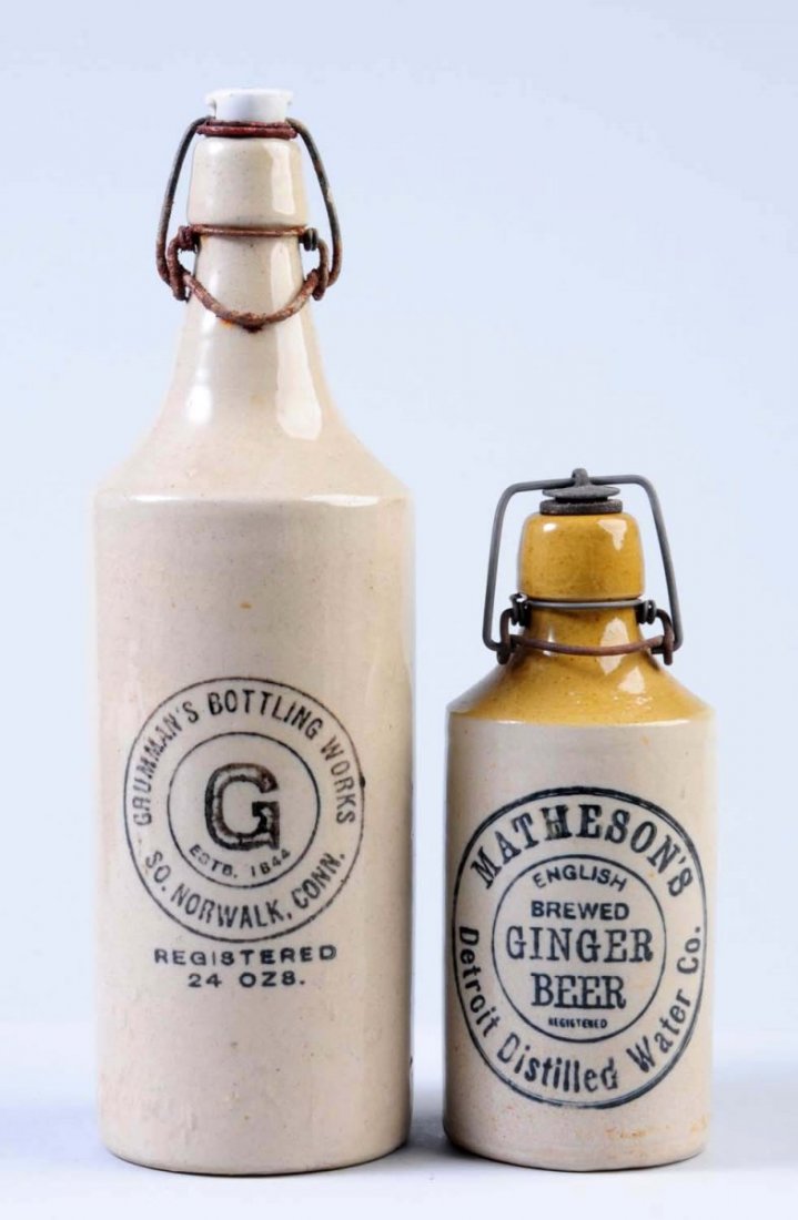Lot of 2: Stoneware Beverage Bottles.: The first bottle is marked "Matheson's English Brewed Ginger Beer Detroit, Michigan." The second bottle is marked " Grumman's Bottling Works South Norwalk, Conn." Condition (Excellent). Size each: 11 