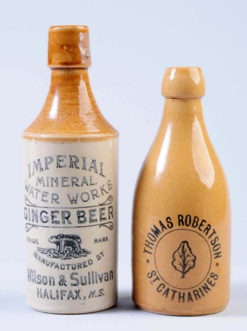 Lot of 2: Stoneware Beverage Bottles.: The first bottle is a highly decorated marked "Imperial Mineral Water Works Ginger Beer Bottle Manufactured by William & Sullivan in Halifax, N.S." This is a very attractive bottle but does have some 