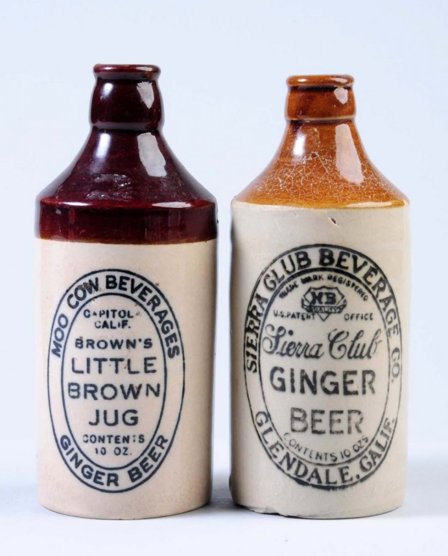 Lot of 2: Stoneware Ginger Beer Bottles.: The first bottle is marked "Moo Cow Beverages Brown's Little Brown Jug Ginger Beer Capital, Cali." The second bottle is marked "Sierra Club Ginger Beer Gendale, Cali." Condition (Excellent). Size Larg