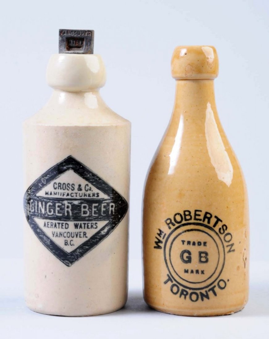 Lot of 2: Stoneware Beverage Bottles.: The first bottle is marked "Cross & Co. Manufacturers Ginger Beer Vancouver, B. C." The second bottle is marked " William Robertson Toronto" Condition (Very Good). Size Each: 7" T.