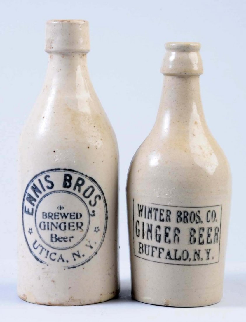 Lot of 2: Stoneware Ginger Beer Bottles.: The first bottle is marked "Winter Brothers Company Ginger Beer Buffalo, NY." May have been some minor repair to the bottom. The second bottle is marked "Ennis Brother's Brewed Ginger Beer Utica, NY."