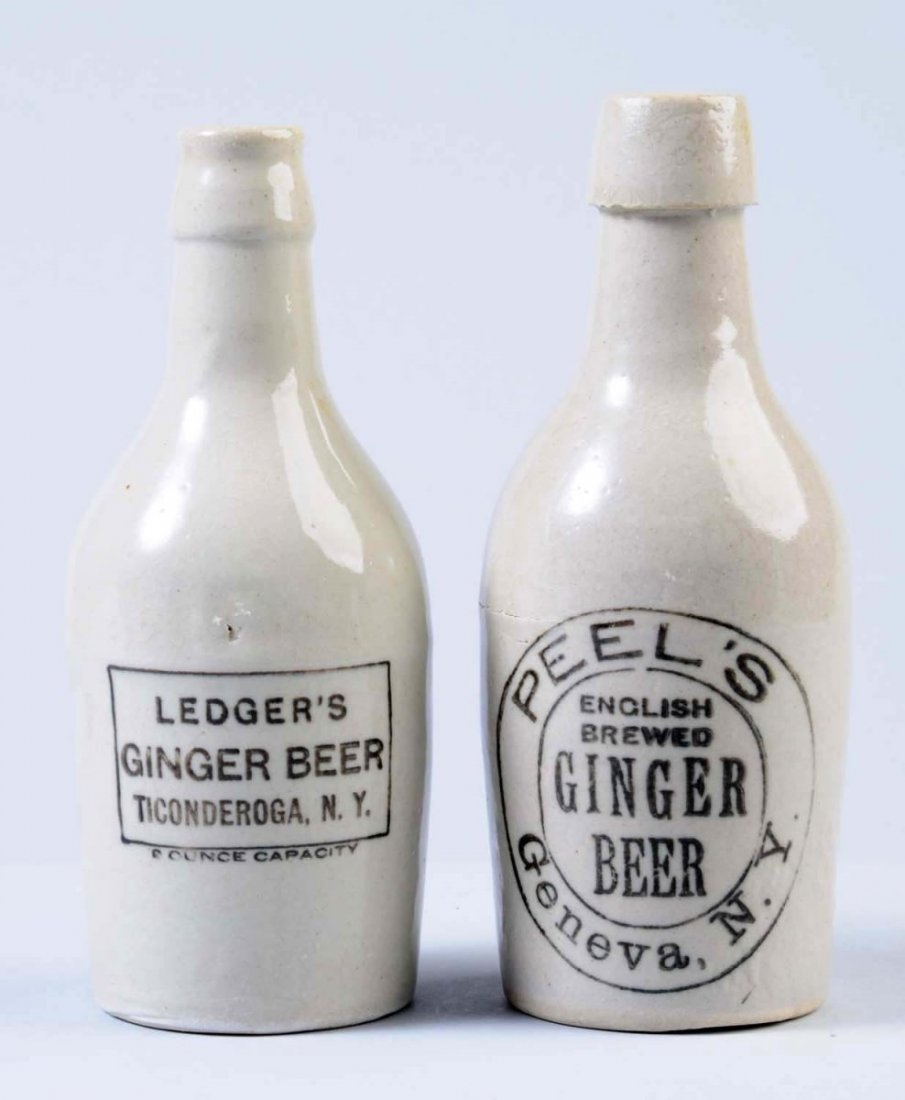 Lot of 2: Stoneware Ginger Beer Bottles.: The first bottle is marked "Ledger's Ginger Beer Ticonderoga, NY." The second bottle is marked "Peel's English Brewed Ginger Beer Geneva, NY. " Condition (Excellent). Size Largest: 7 - 1/4" T.