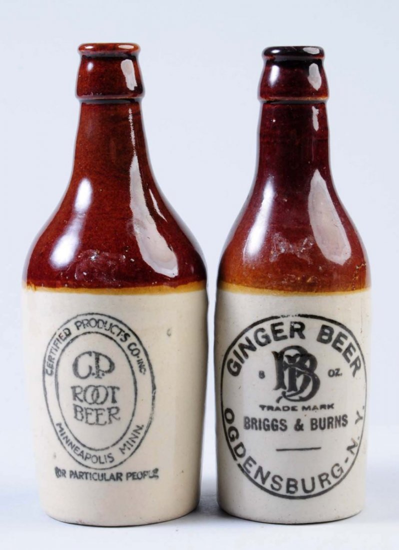 Lot of 2: Stoneware Root Beer Bottles.: First bottle is marked "CP Root Beer Minneapolis, Minn.". The second bottle is marked "Briggs and Burns Ginger Beer Ogdensburgs, NY." Condition (Very Good Plus). Size Each: 8" T.