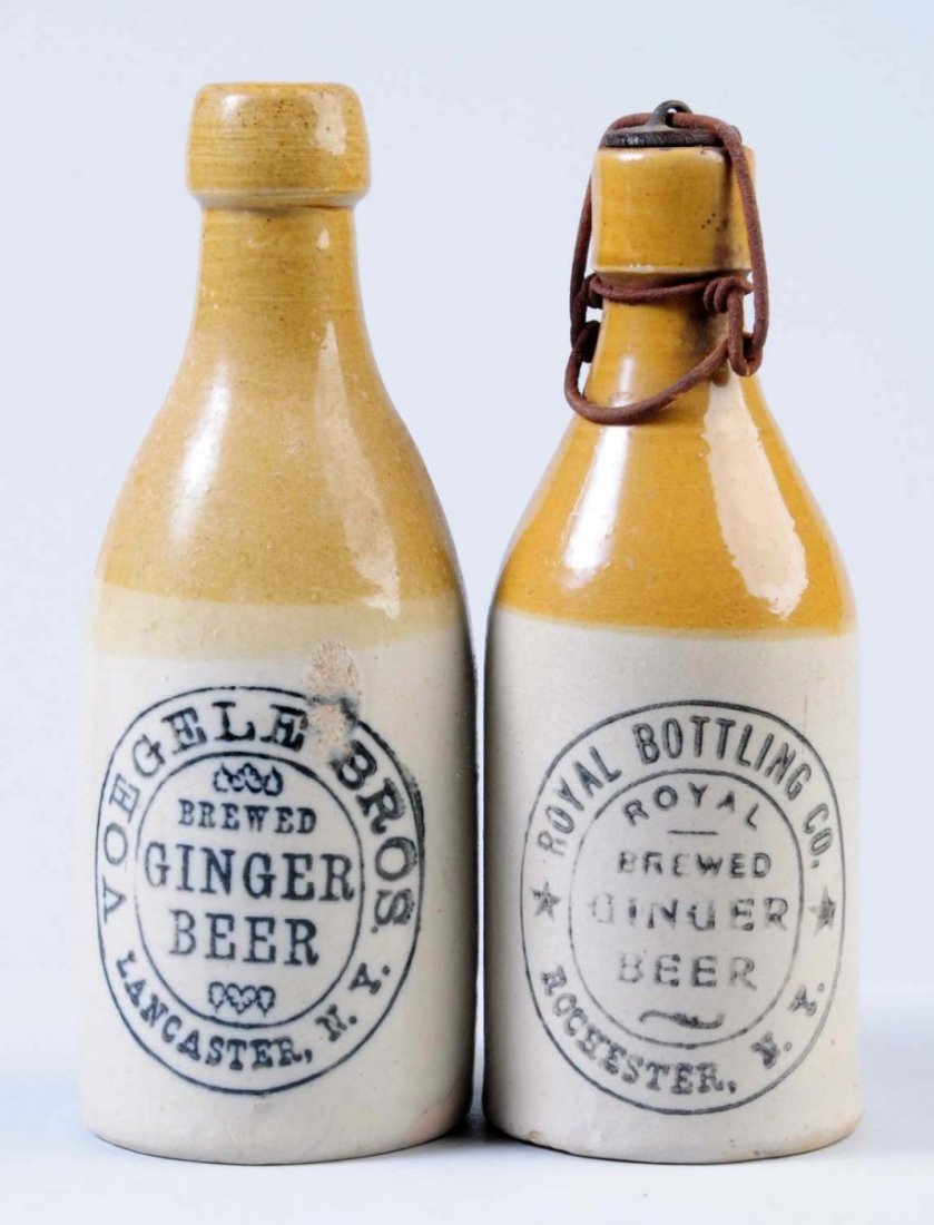 Lot of 2: Stoneware Ginger Beer Bottles.: First bottle is marked "Royal Brewed Ginger Beer Rochester, NY" Second bottle is marked "Voegele Brothers Brewed Ginger Beer Lancaster, NY". Condition (Very Good Plus). Size Largest: 8" T.