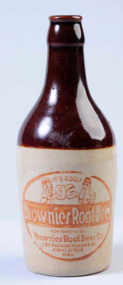 Brownies Root Beer Stoneware Bottle.: This bottle depicts two brownies toasting one another and was bottled by the Brownies Brewing Company in Minneapolis, Minn. Condition (Excellent). Size 8" T.