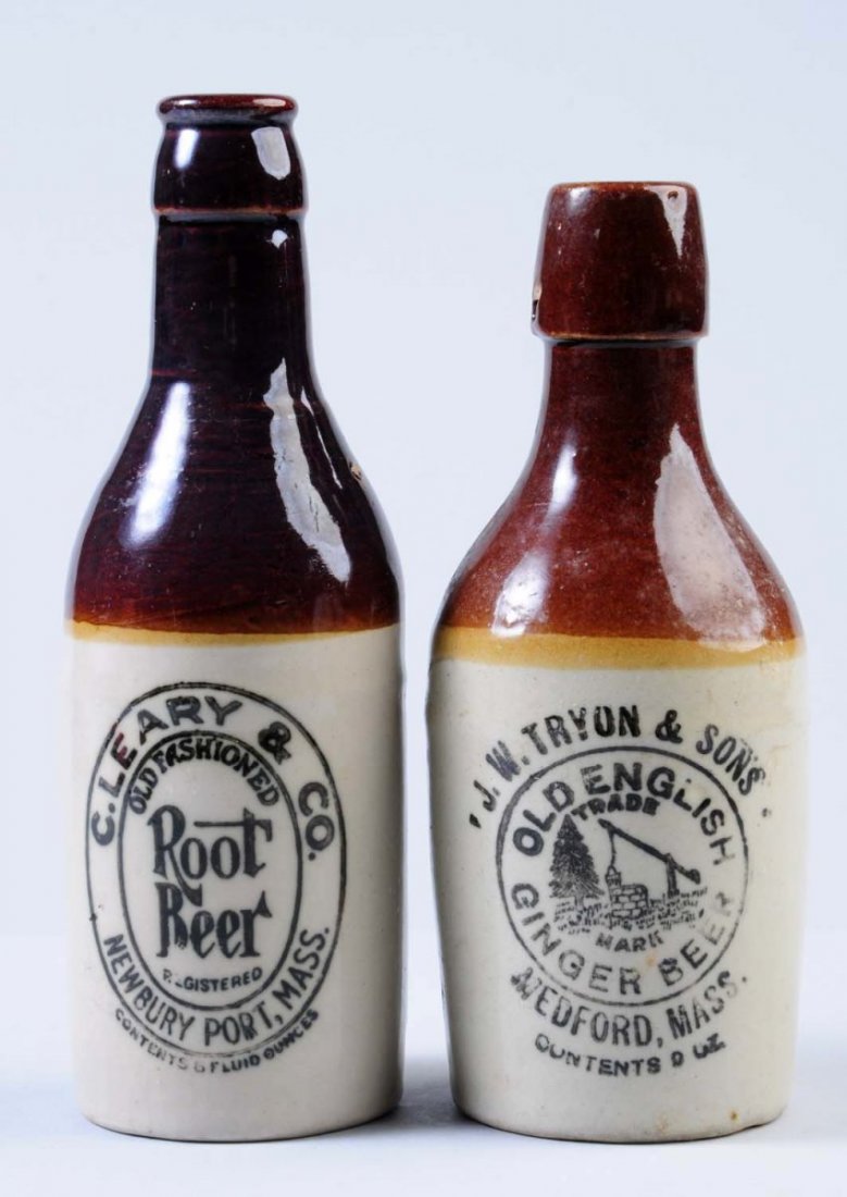 Lot of 2: Stoneware Beverage Bottles.: First bottle is marked "J. W Tryon & Sons Old Ginger Beer Medford, Mass" Second bottle is marked "C. Leary and Company Root Beer Newbury Port, Mass." Condition (Excellent). Size Largest: 8" T.